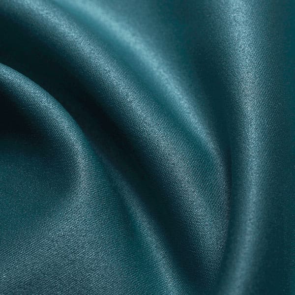 Close-up of Teal contract fabric sample for care home interiors
