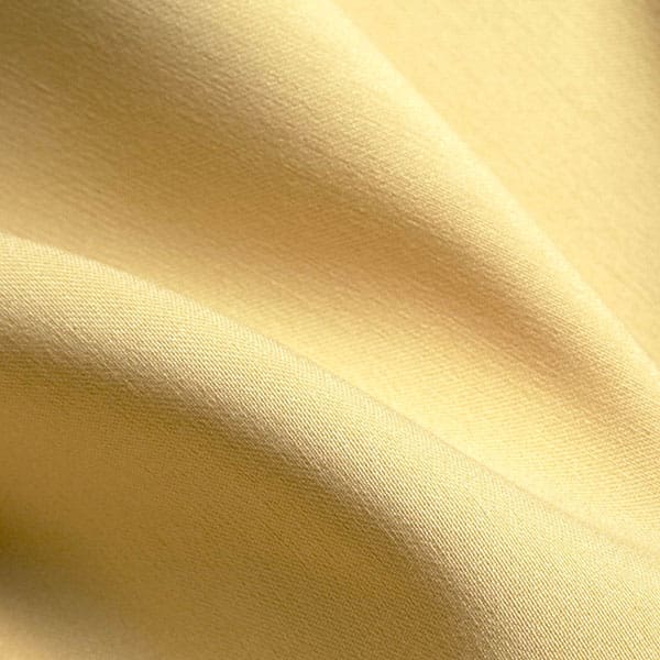 Close-up of Lemon contract fabric sample for care home interiors