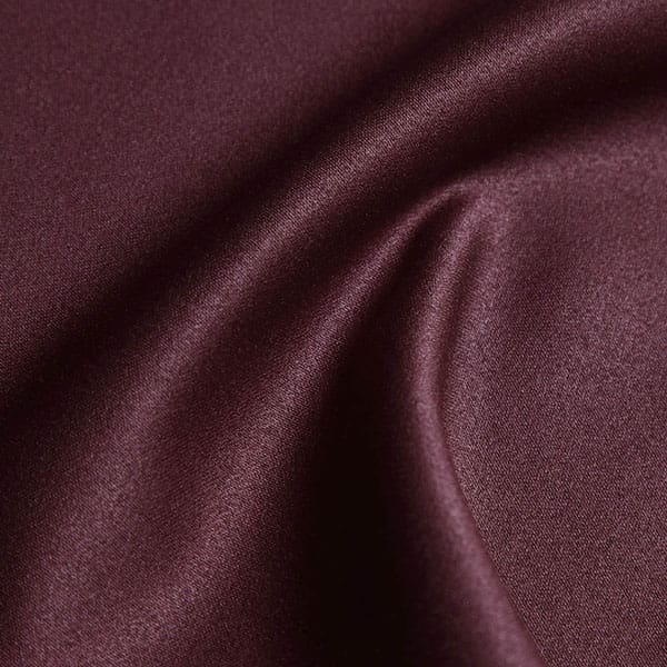Close-up of Burgundy contract fabric sample for care home interiors