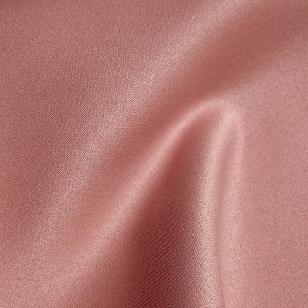 Close-up of Powderpink contract fabric sample for care home interiors