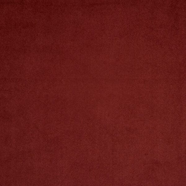 Close-up of Luxe Tuscan Red X contract fabric sample for care home interiors