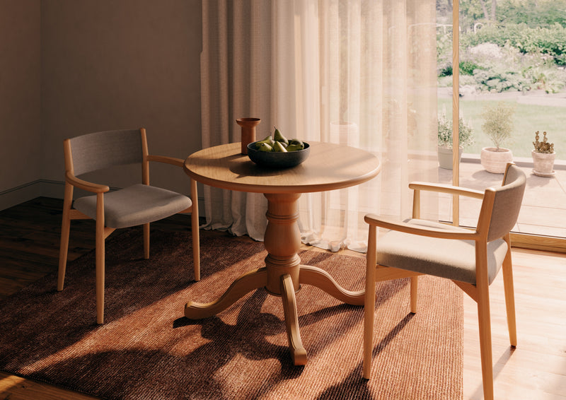 Americano circular dining table shown with seating in a care home dining room