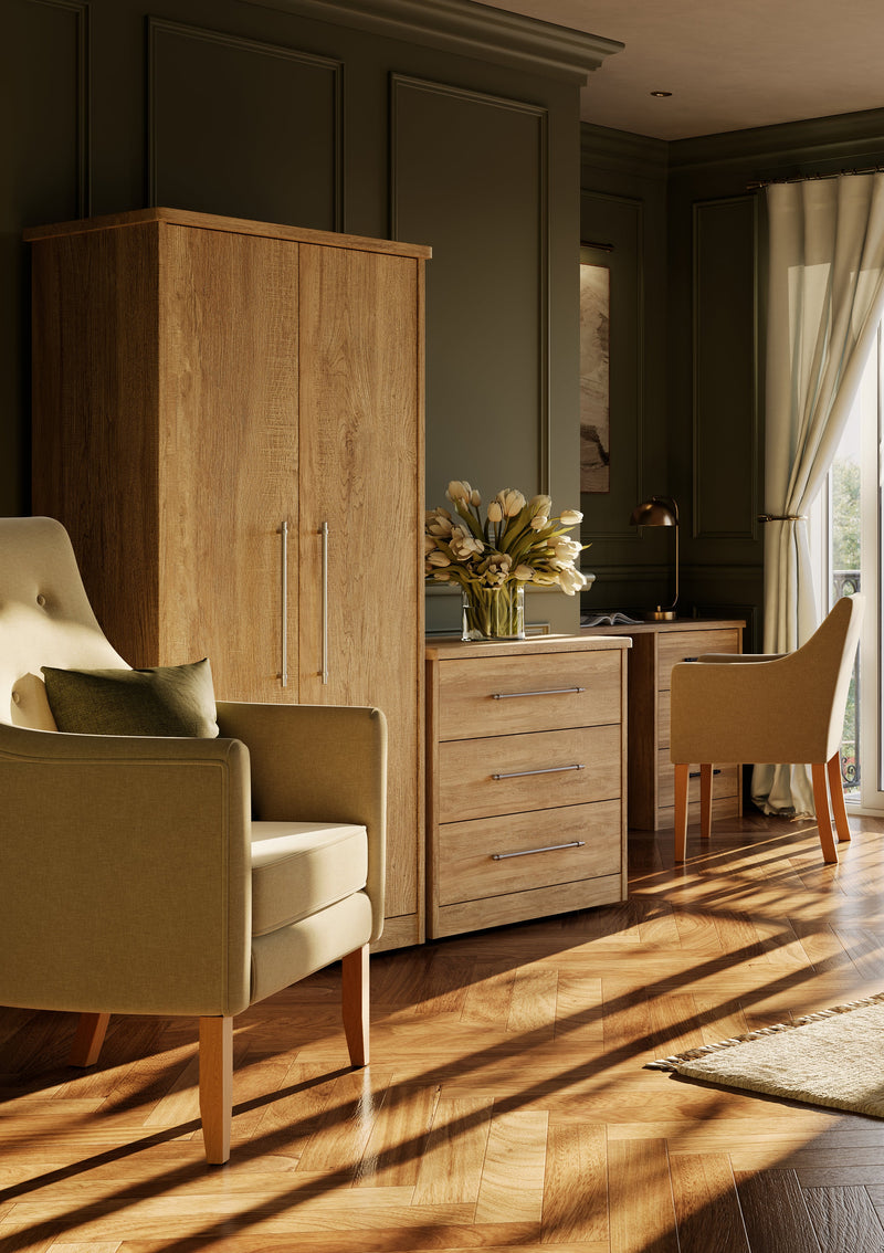 Coordinated bedroom furniture shown in a styled care home room