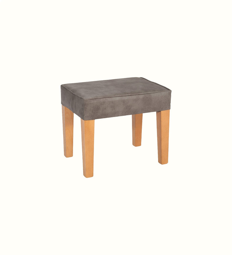 Medium footstool with tapered legs for an elderly care lounge