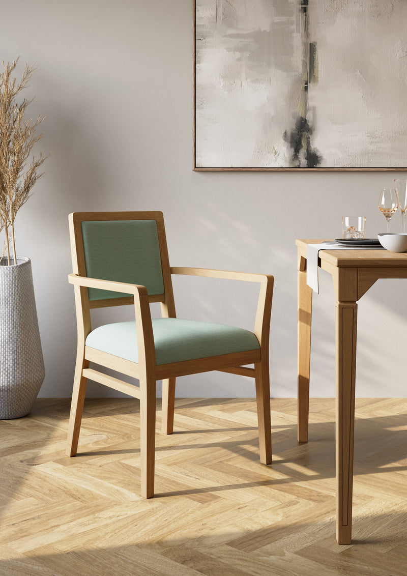 Armchair for an elderly care lounge shown in a styled room setting