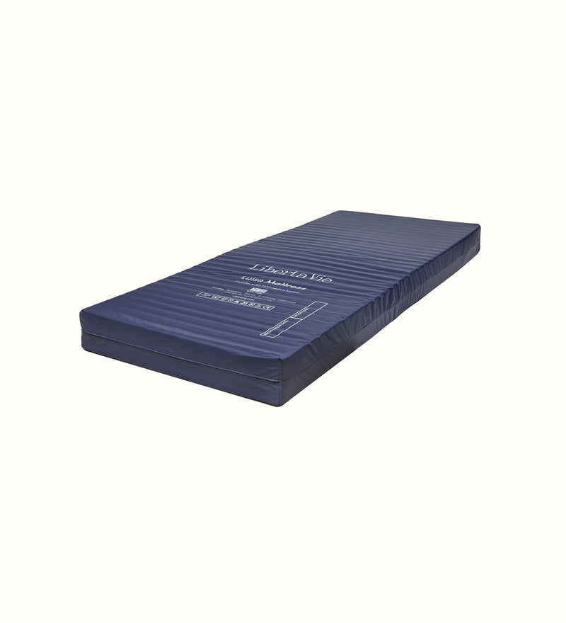 Care mattress for a care home bedroom