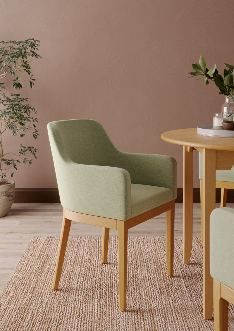 Naomi Arm armchair for an elderly care lounge shown in a styled room setting