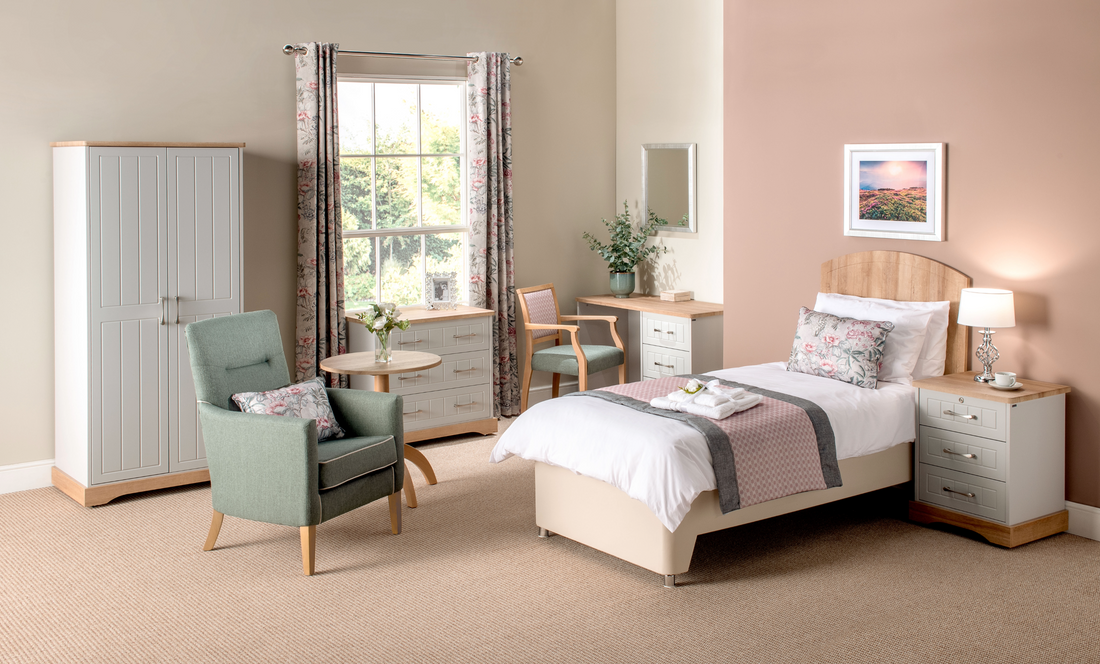 Neatly arranged bedroom with furniture including a bed, chair, and wardrobe.
