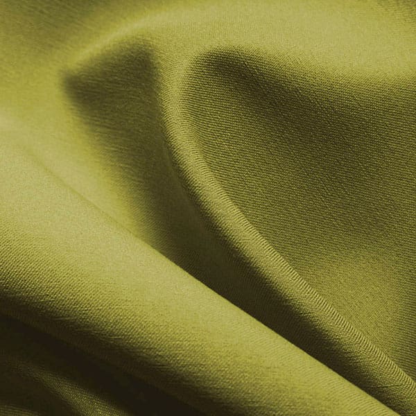 Close-up of Spectrum Green contract fabric sample for care home interiors
